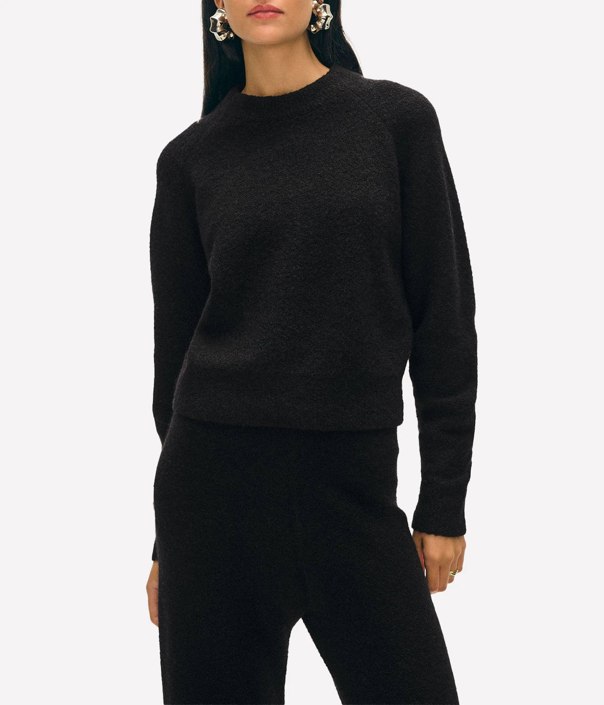 ALT text: White + Warren boucle cashmere sweatshirt in black, styled with matching pants for an elevated loungewear set.