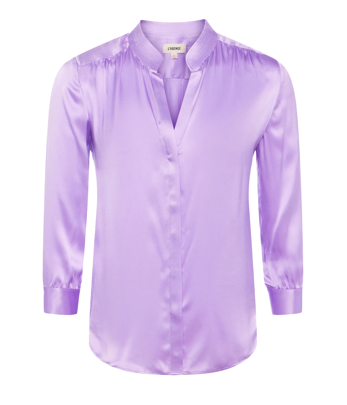 ALT Text: Dani Blouse in 100% silk, featuring a high-low shirttail hem and three-quarter sleeves, perfect for versatile styling from office to casual chic.