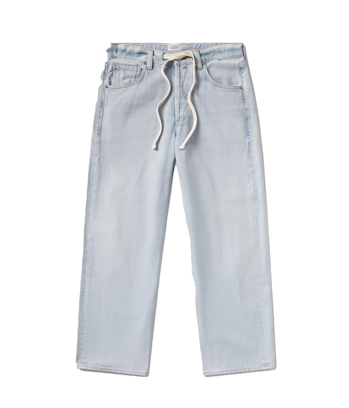  Woman wearing light indigo denim drawstring trousers with soft fading and relaxed fit, made from regenerative cotton. Brisbane, James Street. Shopping. Denim 