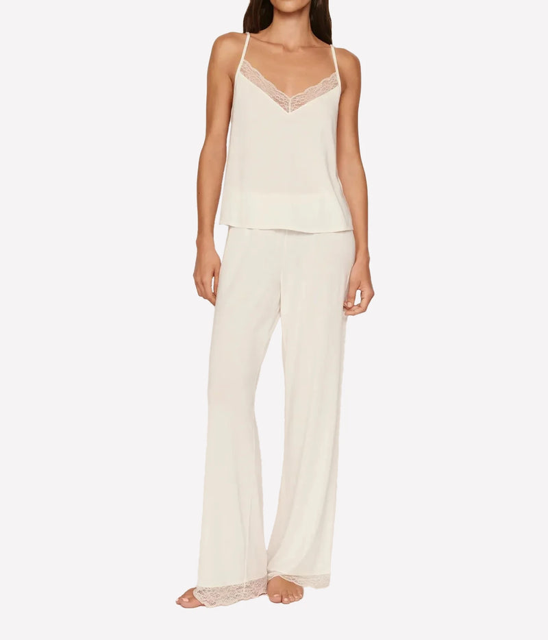 Model wearing the Eberjey Kari Cami & Pant Pj Set in Ivory, full-length front view showing the lace-trimmed V-neck cami with fine straps and straight leg pants