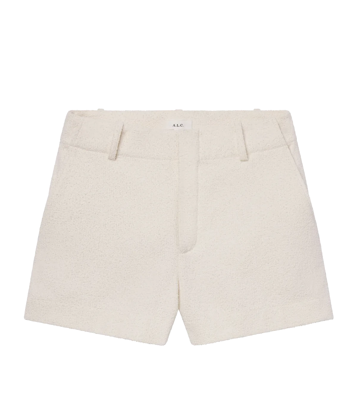 ALT text: A pearl-white tweed short with a high waist, cuffed hem, and discreet side pockets, styled in a soft Italian cotton blend.