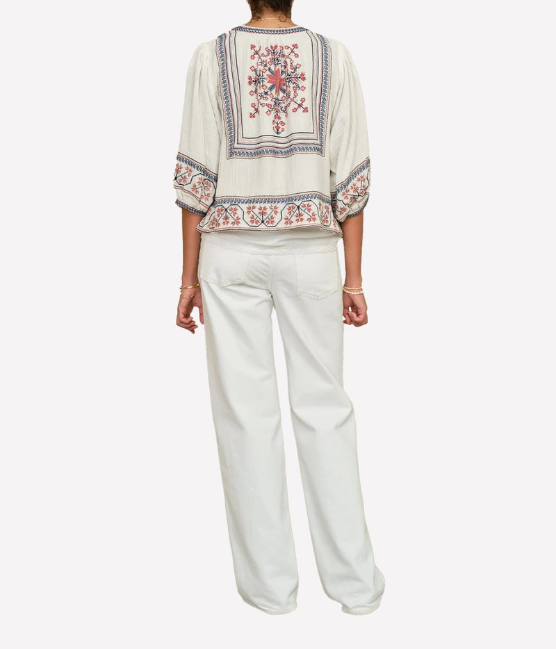 Model wearing the M.A.B.E Calista Embroidered Jacket in Ecru Multi – back view