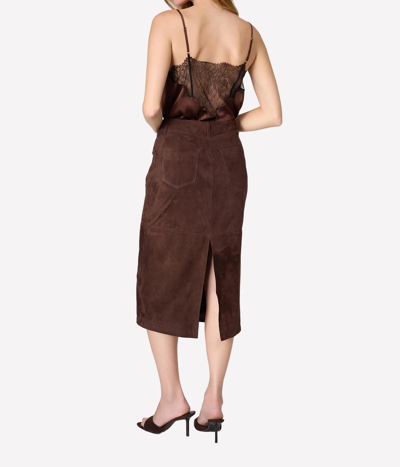 Full-length back view of model wearing Cami NYC Daisy Silk Camisole in Umber with a brown midi skirt