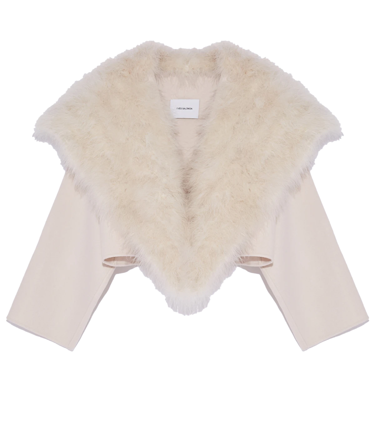 Luxurious cashmere V-neck sweater in leaf heather, styled with jeans and boots for a cosy yet refined look.