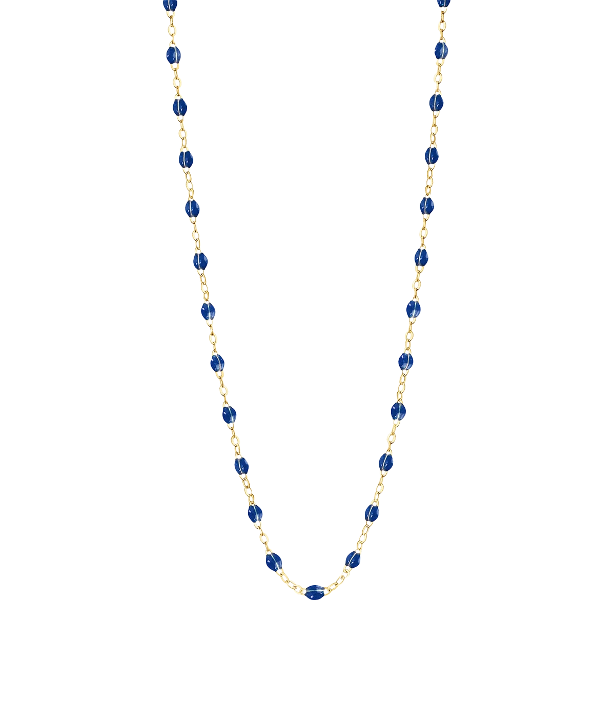 Delicate gold necklace with lapis resin beads, styled for both layered and solo looks.