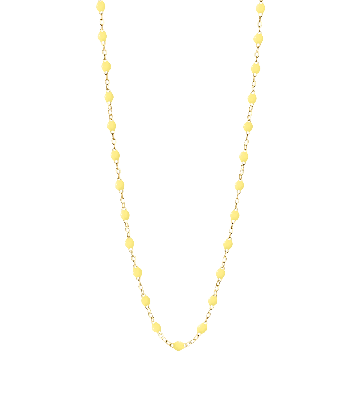 Gold necklace with delicate mimosa resin beads, styled for layering and solo wear.