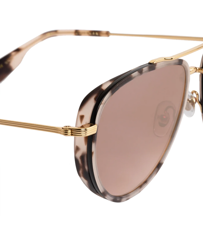 Close-up of the KREWE Coleman Sunglasses in Matte Black Tortoise, showing the acetate mini side shield and gold hinge