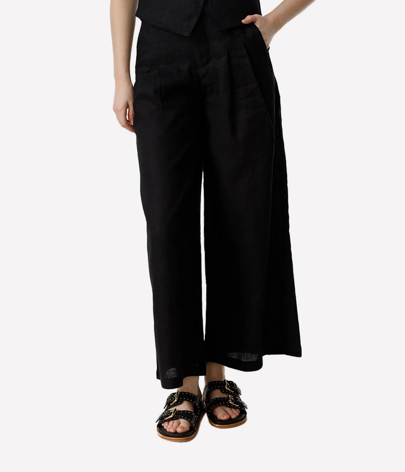 Introducing Lanhtropy's high-waisted Culotte Linen Pants—a perfect blend of comfort and style designed for the modern fashionista. These wide-leg pants feature a structured waistband that provides optimal support, ensuring a snug fit around the waist while enhancing your natural silhouette. With their flattering cut, these culotte pants are versatile enough for both casual outings and more formal occasions, making them a staple in any wardrobe.

Product Details:

High-Rise Pleated Waist: Adds structure and 