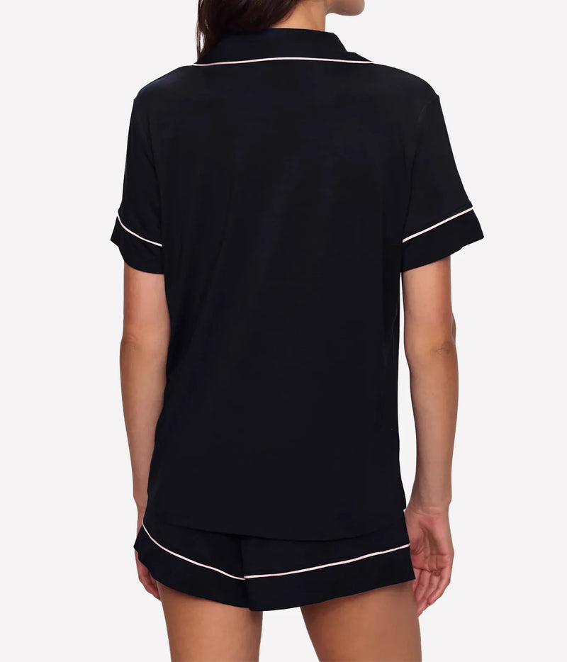 Back view of a model wearing the Eberjey Gisele Relaxed Short PJ Set In Black Sorbet Pink, showing the relaxed fit of the top and piped shorts