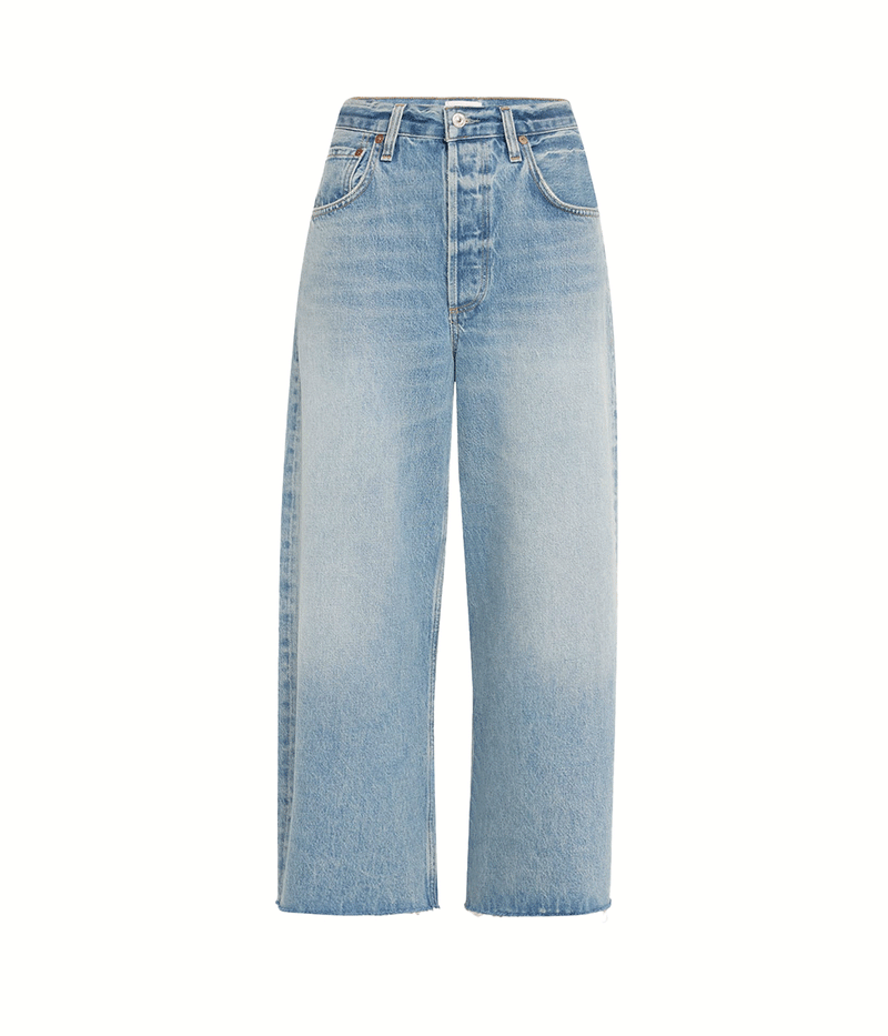 Flat lay view of Citizens of Humanity Ayla Raw Hem Crop Jean in Sodapop featuring a relaxed rise, cropped raw hem, and faded medium indigo wash.