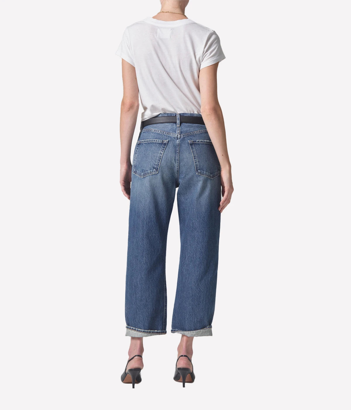 ALT Text: Relaxed vintage tapered jeans in a light indigo wash, styled with a low-rise fit and baby rolled cuffs.