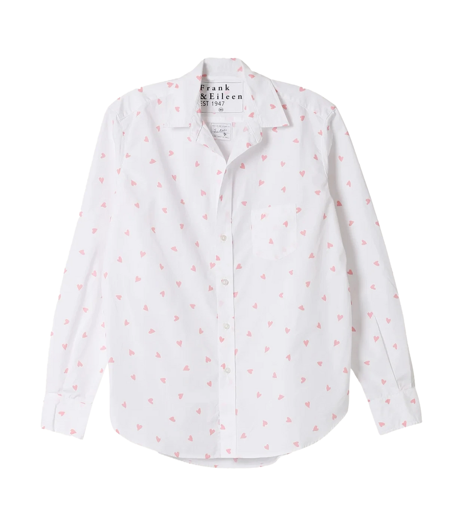 Frank and Eileen’s bestselling Eileens shirt crafted from 100% Italian Cotton. A white long sleeve button up shirt with scattered pink hearts, the hem of this bra-friendly wash and wear shirt is long enough to cover your bum. Adorned with a chest pocket and no back pleat, the bust-flattering button placement and soft, round shoulder looks great on every body!   