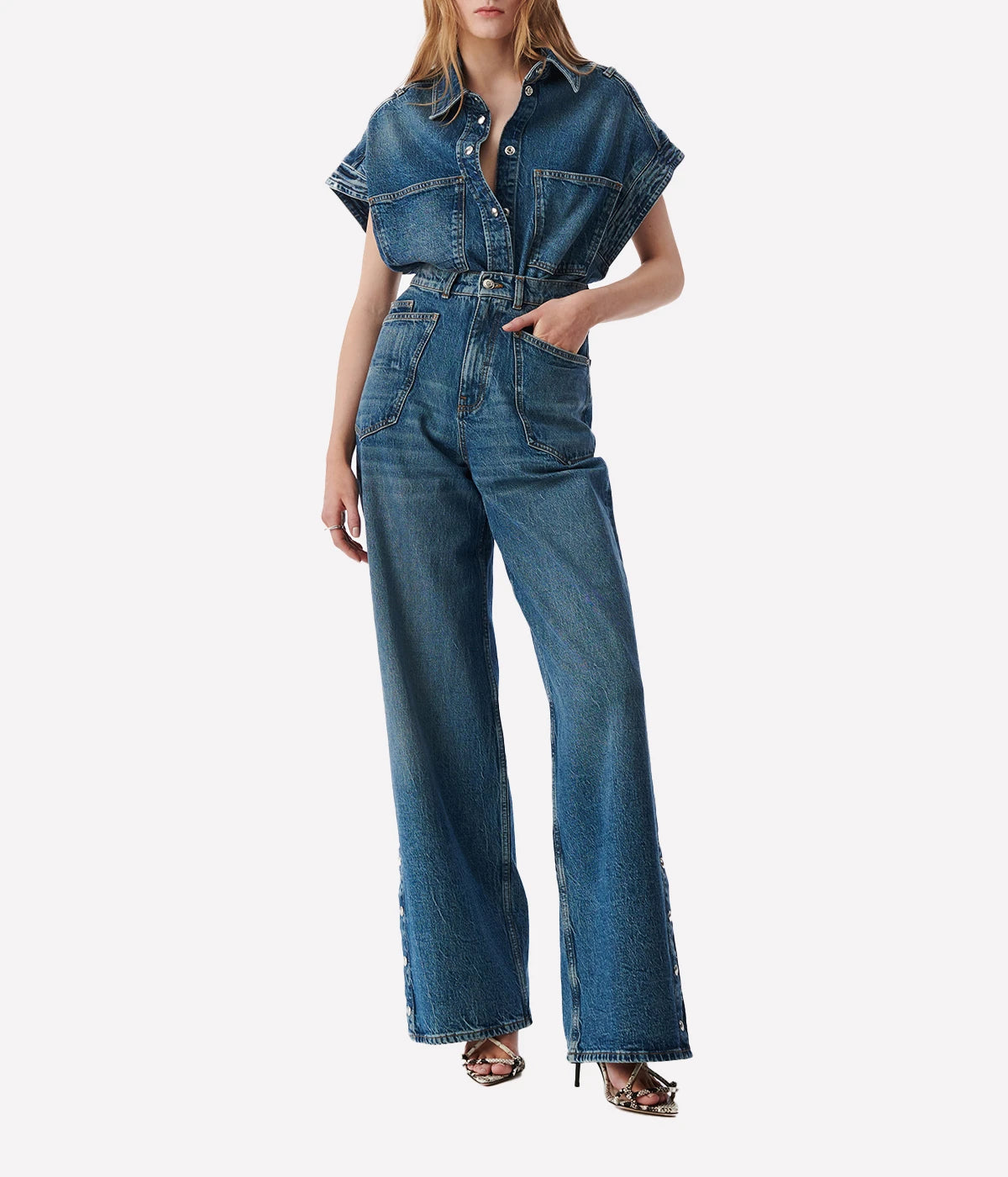 Elycia Denim Shirt in Denim Blue by IRO, sleeveless with a collar, breast pockets, and metal pop buttons, offering a relaxed fit in classic denim blue.