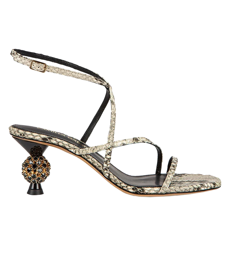 A single women's heeled sandal with a snakeskin-patterned upper, black ankle strap, and a decorative black and gold ball detail on the heel, shown against a plain white background.
