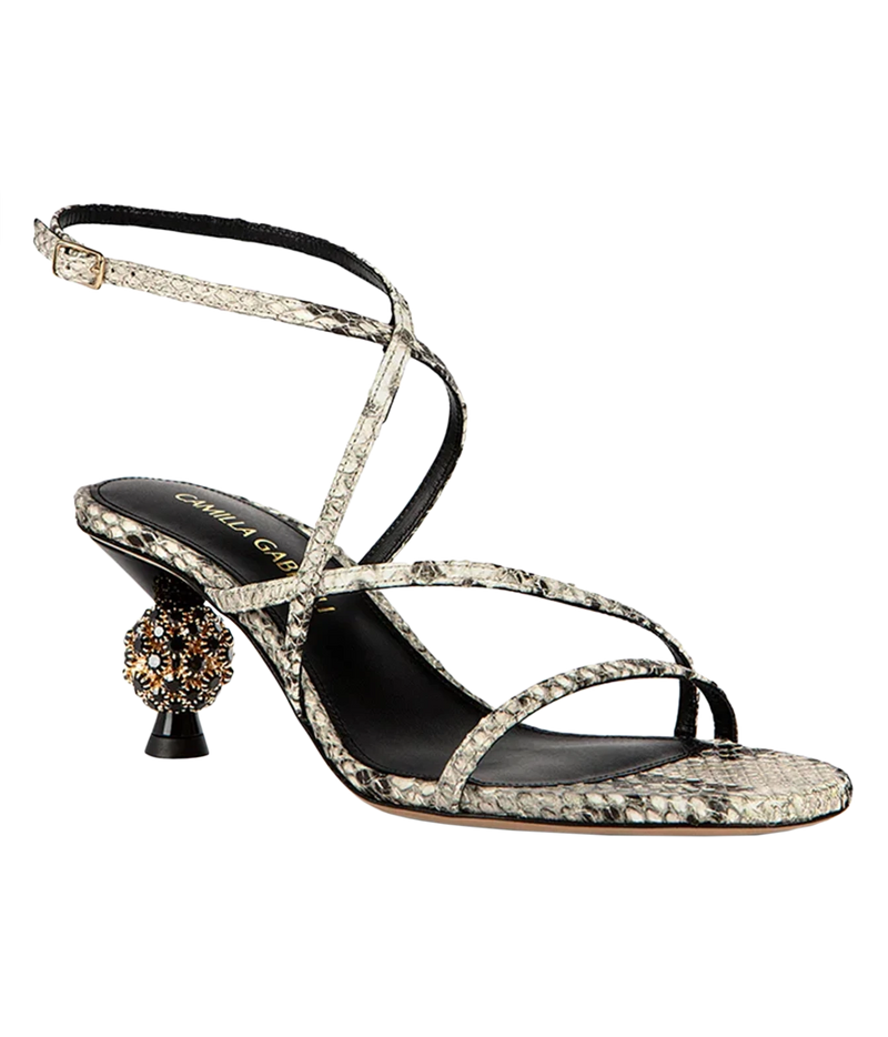 A single women's heeled sandal, featuring a snakeskin-patterned strap and toe strap, a black insole with gold branding.