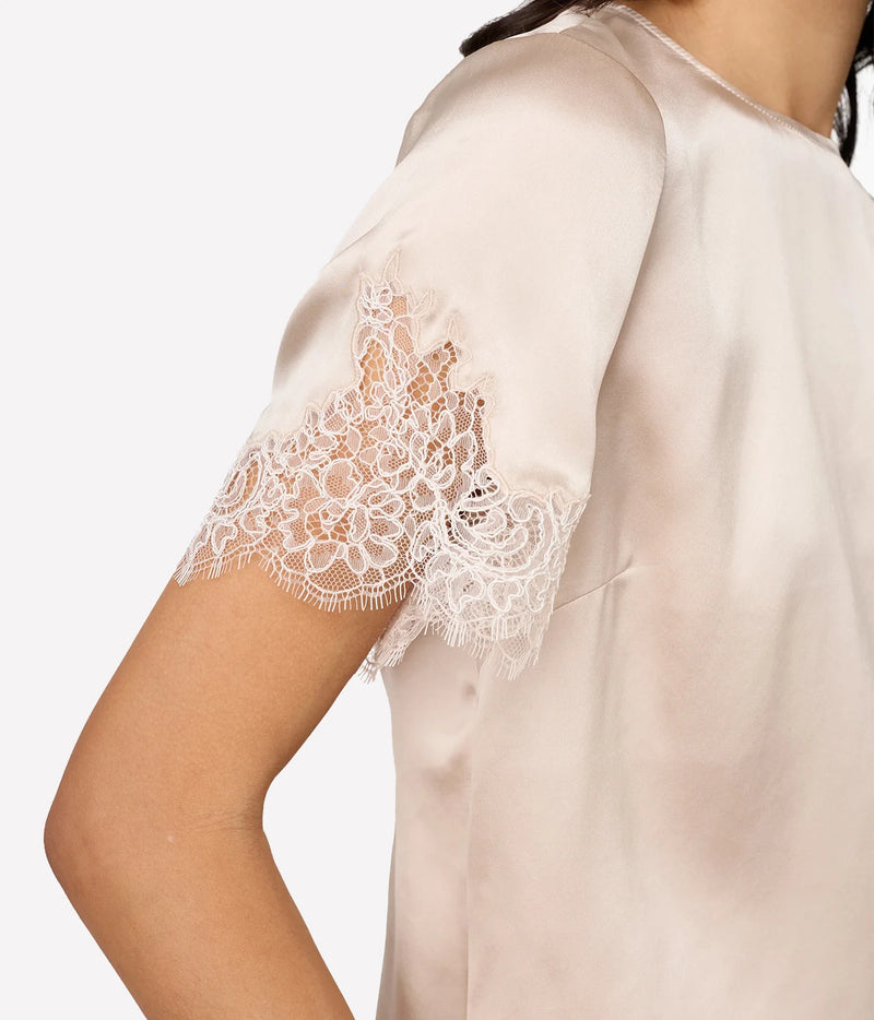 Close-up of Cami NYC Marguerite Silk Top in Oat showing the sheer corded lace sleeve trim