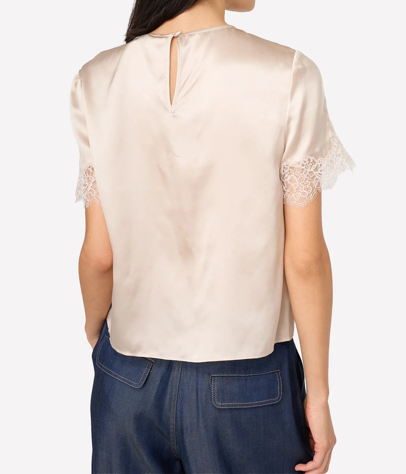 Back view of model wearing Cami NYC Marguerite Silk Top in Oat showing the keyhole button closure