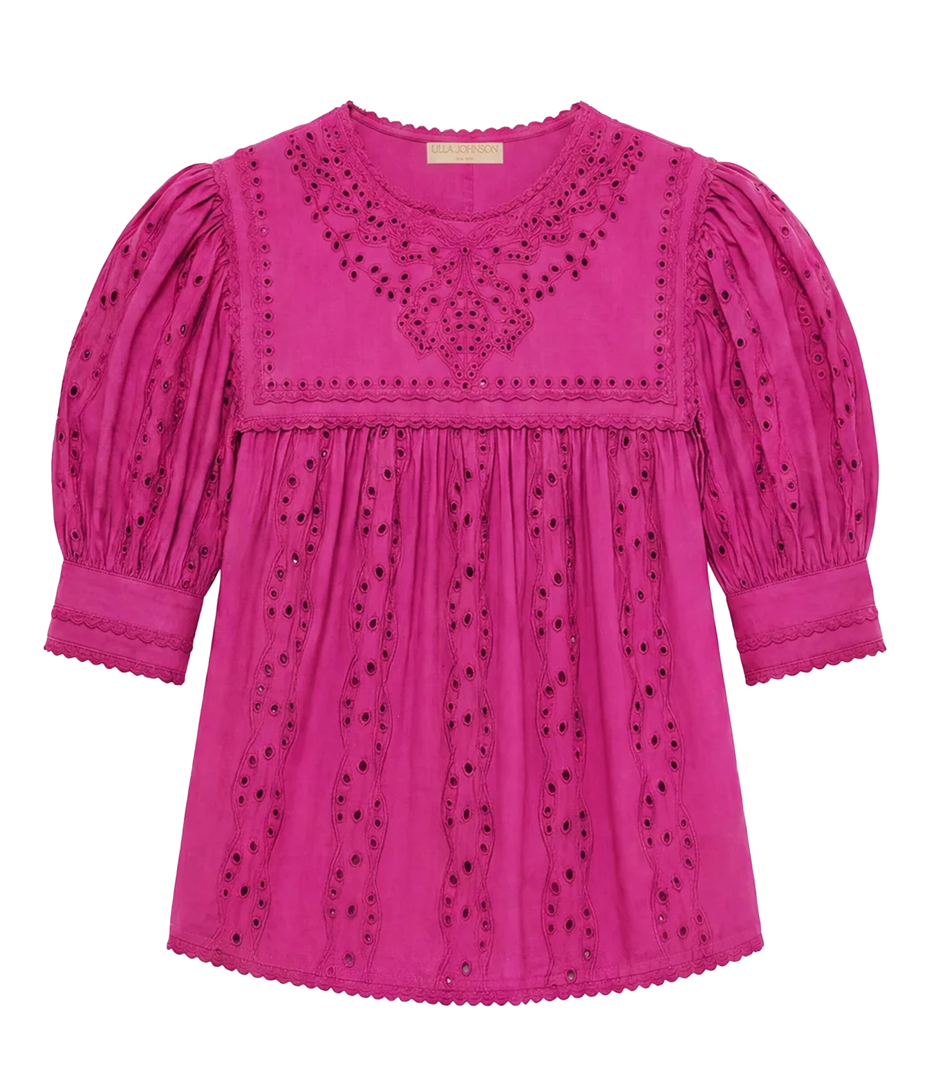 A bright pink eyelet cotton blouse with puffed sleeves, scalloped edges, and embroidered detailing on the chest and bodice, shown flat against a white background.