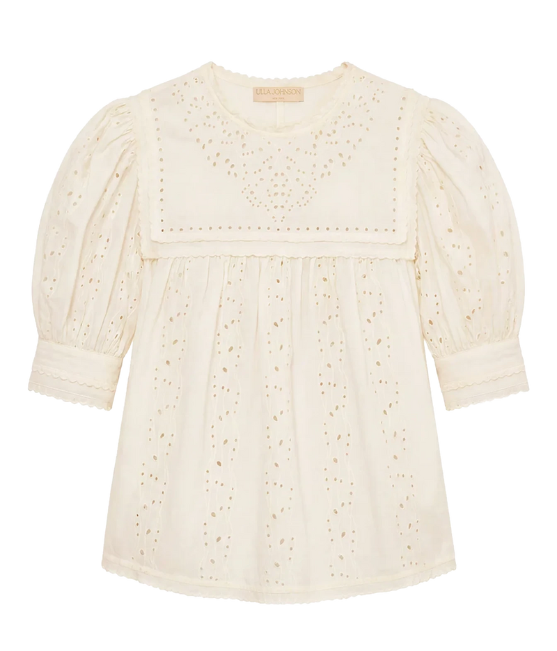 An off-white eyelet cotton blouse with puff sleeves and a decorative embroidered yoke, shown flat on a white background.