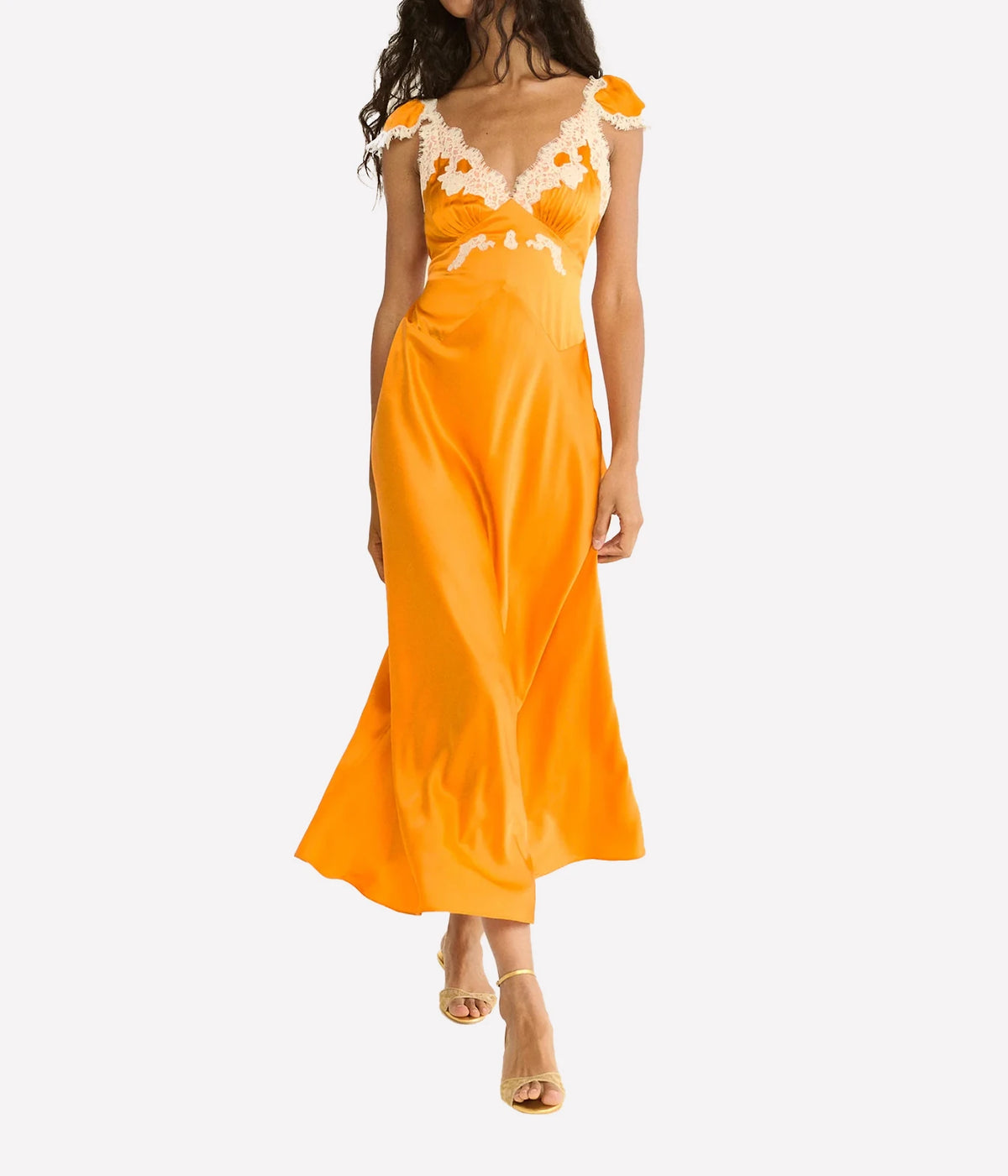 DÔEN Fiona Dress in Tangerine, walking front model view highlighting the silk satin and cap sleeves.
