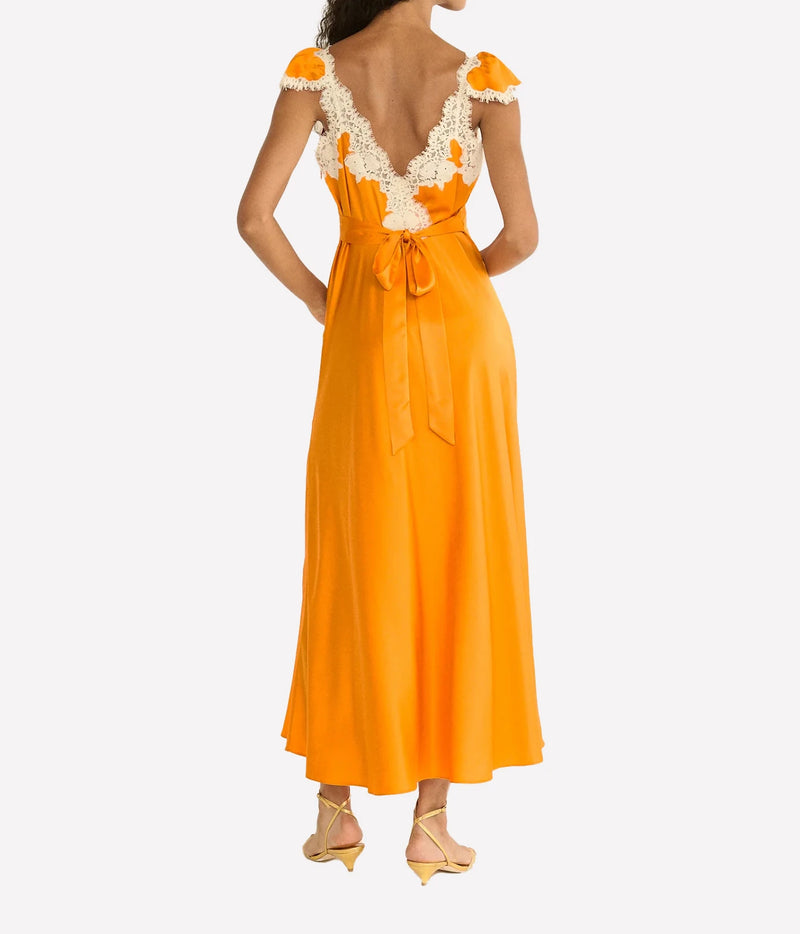 DÔEN Fiona Dress in Tangerine, back model view highlighting the self-tie detail and fluid skirt.