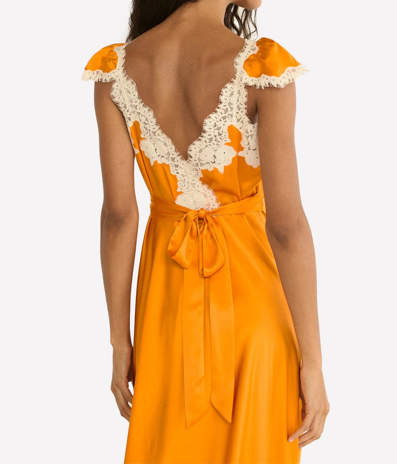 DÔEN Fiona Dress in Tangerine, close-up highlighting the plunging neckline and floral lace trim.