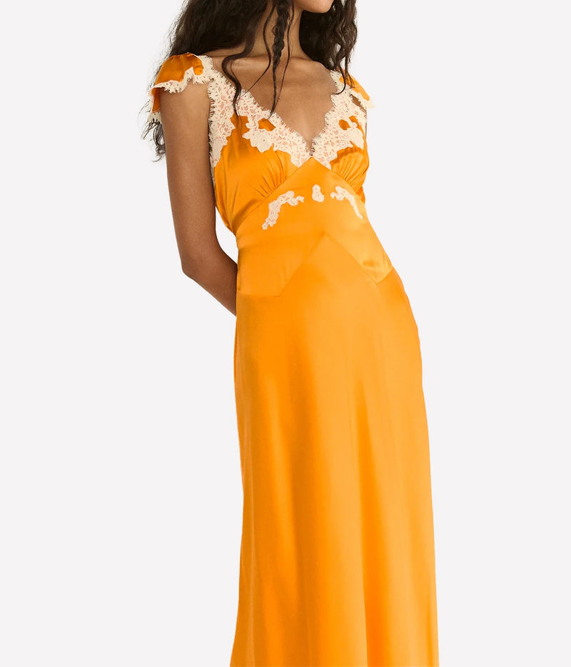DÔEN Fiona Dress in Tangerine, detail view highlighting the lustrous silk satin and delicate lace.