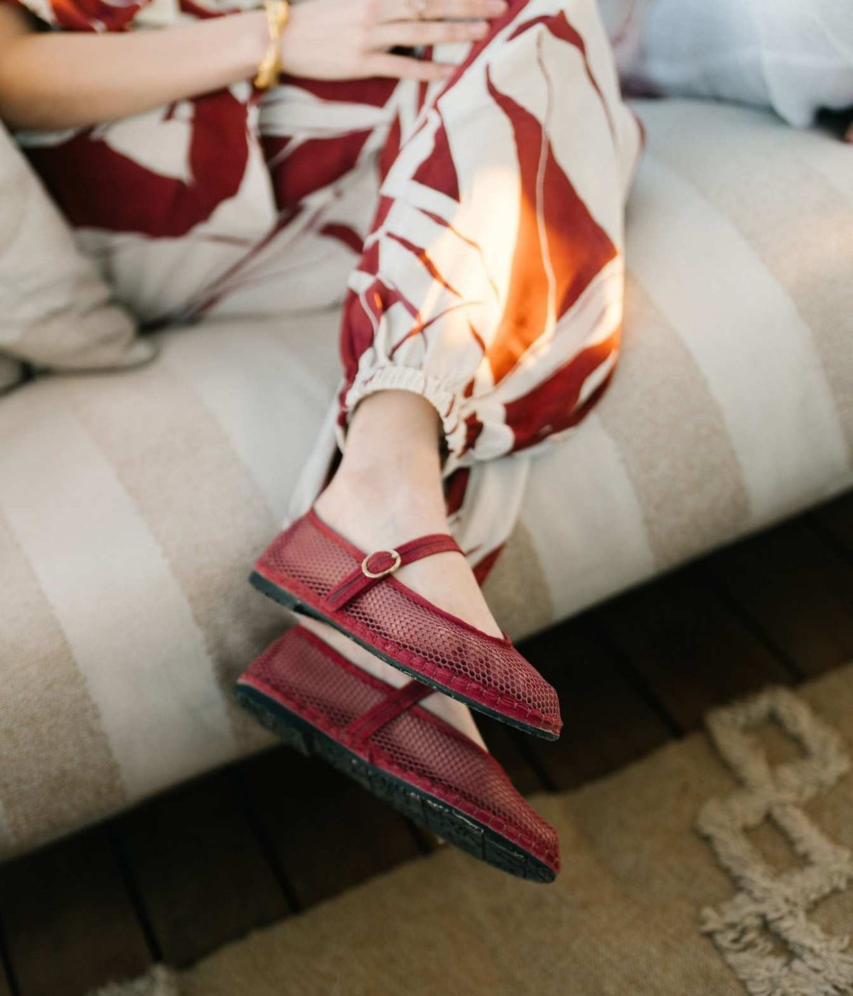 Flabelus Isabella Mary Jane flats in garnet mesh, worn with a red and white printed outfit
