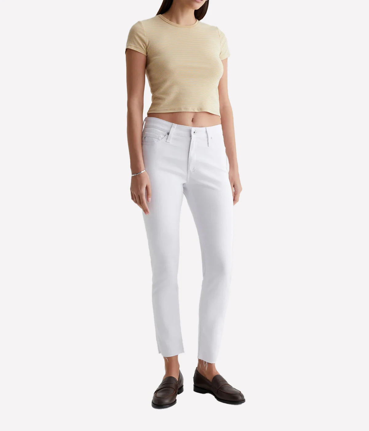Farrah Skinny Ankle jean in white, featuring a high-rise waist, streamlined fit, and ankle-length raw hems for a chic and modern look.