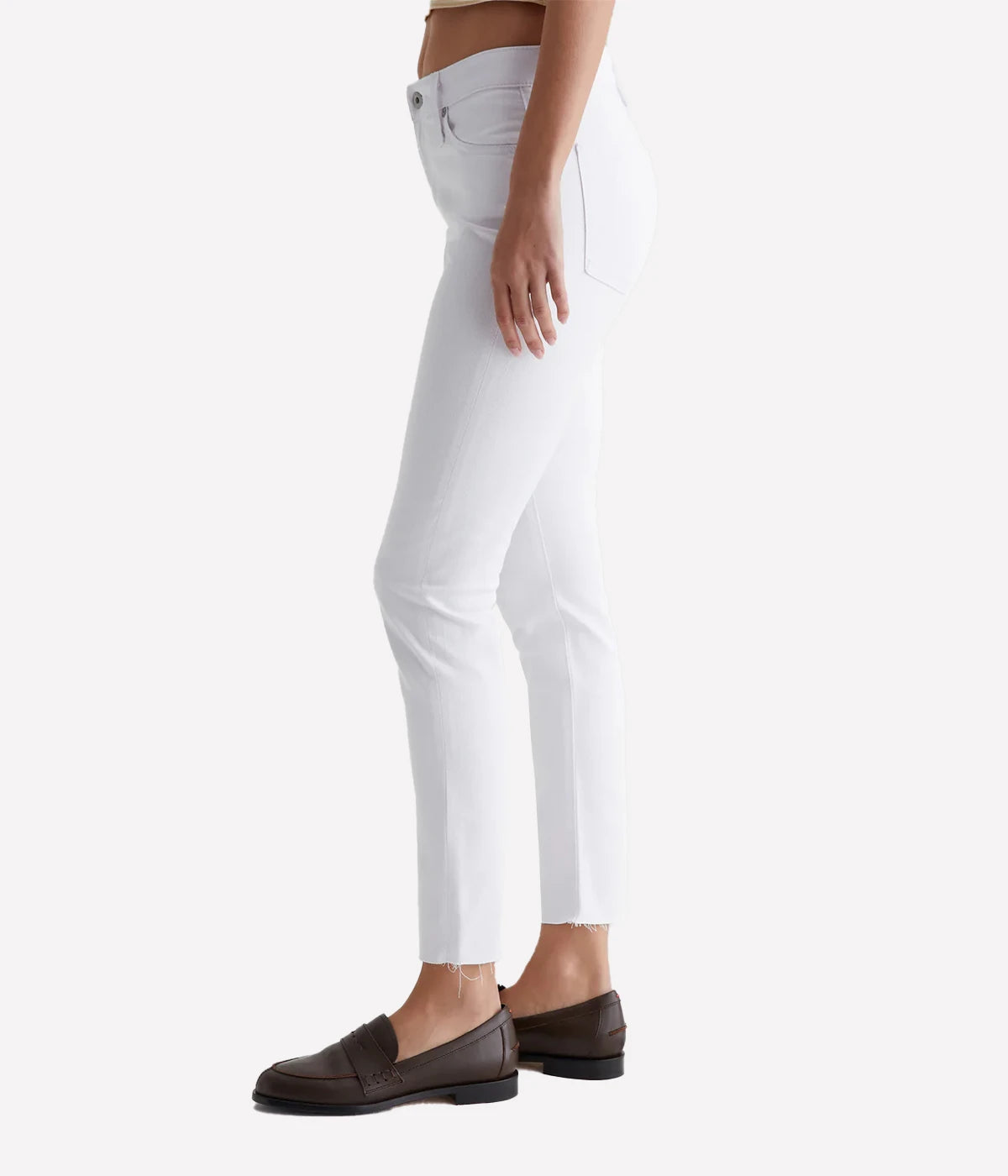 Farrah Skinny Ankle jean in white, featuring a high-rise waist, streamlined fit, and ankle-length raw hems for a chic and modern look.