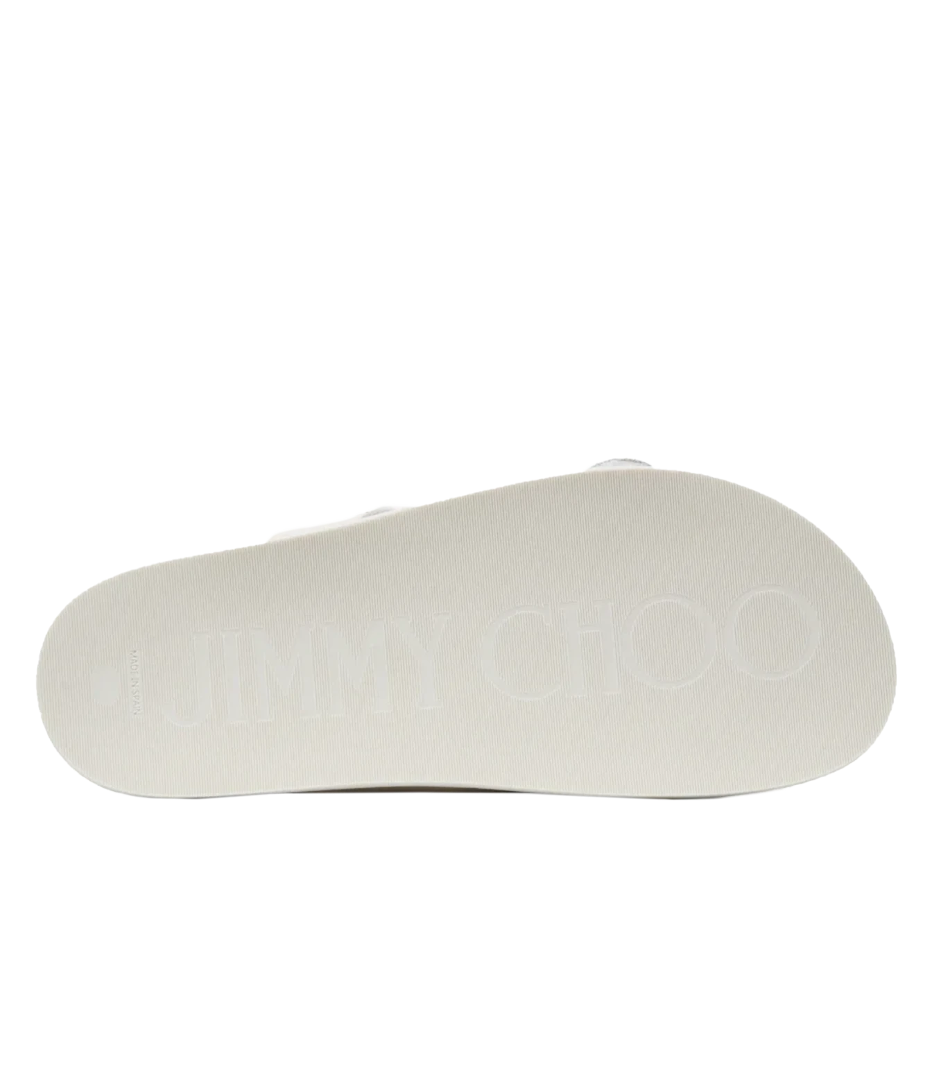 The bottom sole of a Jimmy Choo slide sandal, featuring the brand name 'JIMMY CHOO' embossed in a light tone on a white textured background.