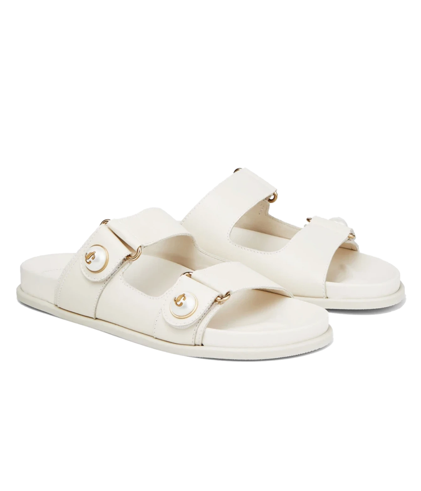 A pair of off-white double-strap slide sandals with gold-tone hardware and decorative round studs, shown on a plain white background.