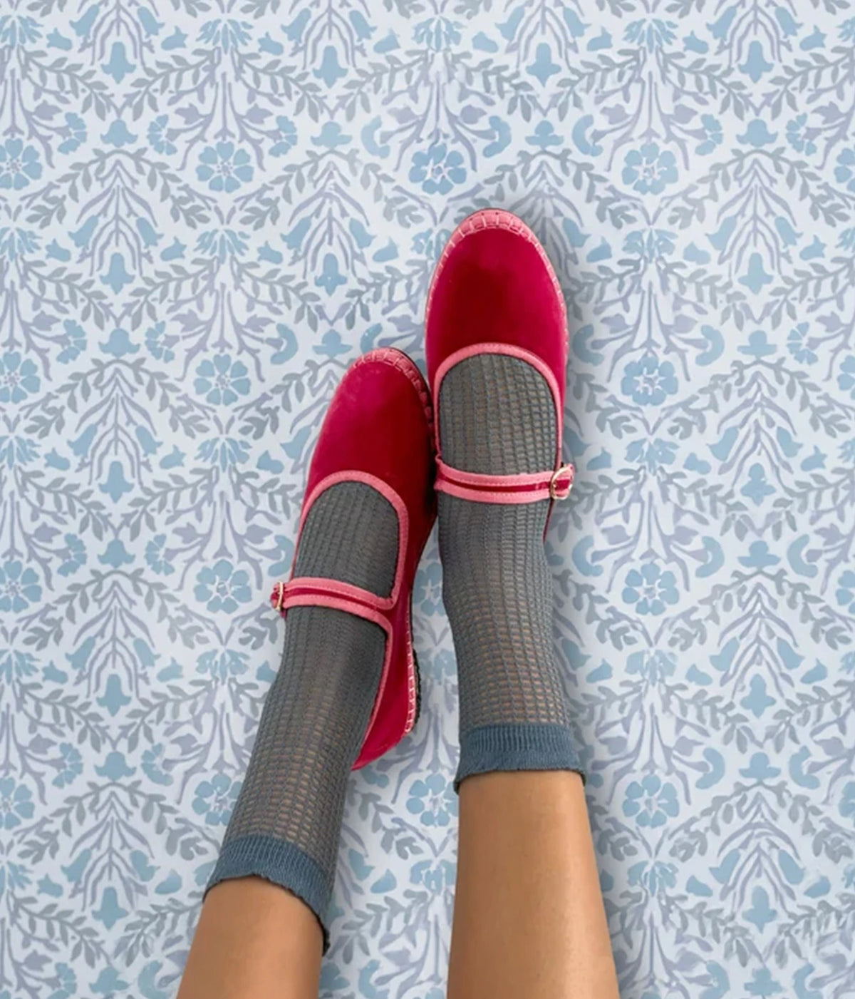 Overhead view of legs wearing the Flabelus Frances in Rosa with grey pointelle crew socks