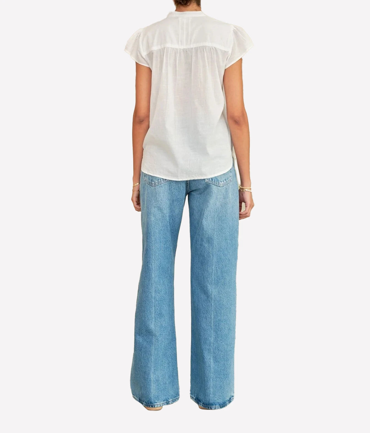 Model wearing the M.A.B.E Freya Short Sleeve Top in White – back view