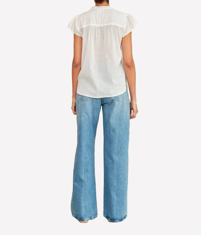 Model wearing the M.A.B.E Freya Short Sleeve Top in White – back view