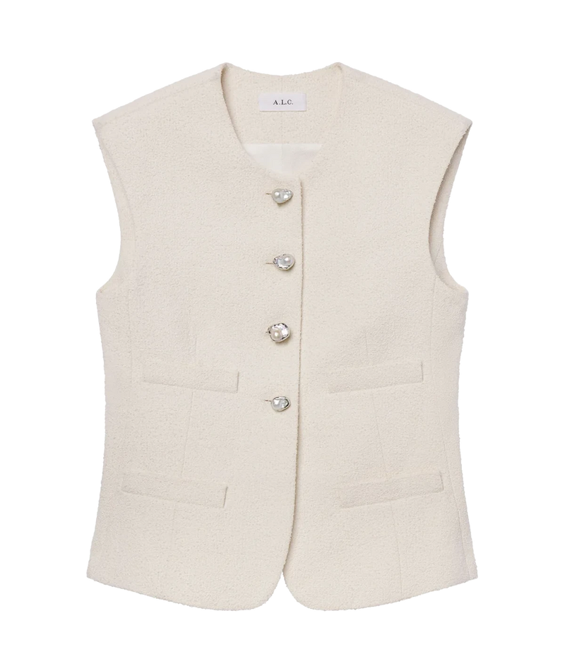 ALT text: Pearl-white Italian tweed vest with freshwater pearl buttons, round neckline, and welt pockets, styled in a sleeveless tailored silhouette.