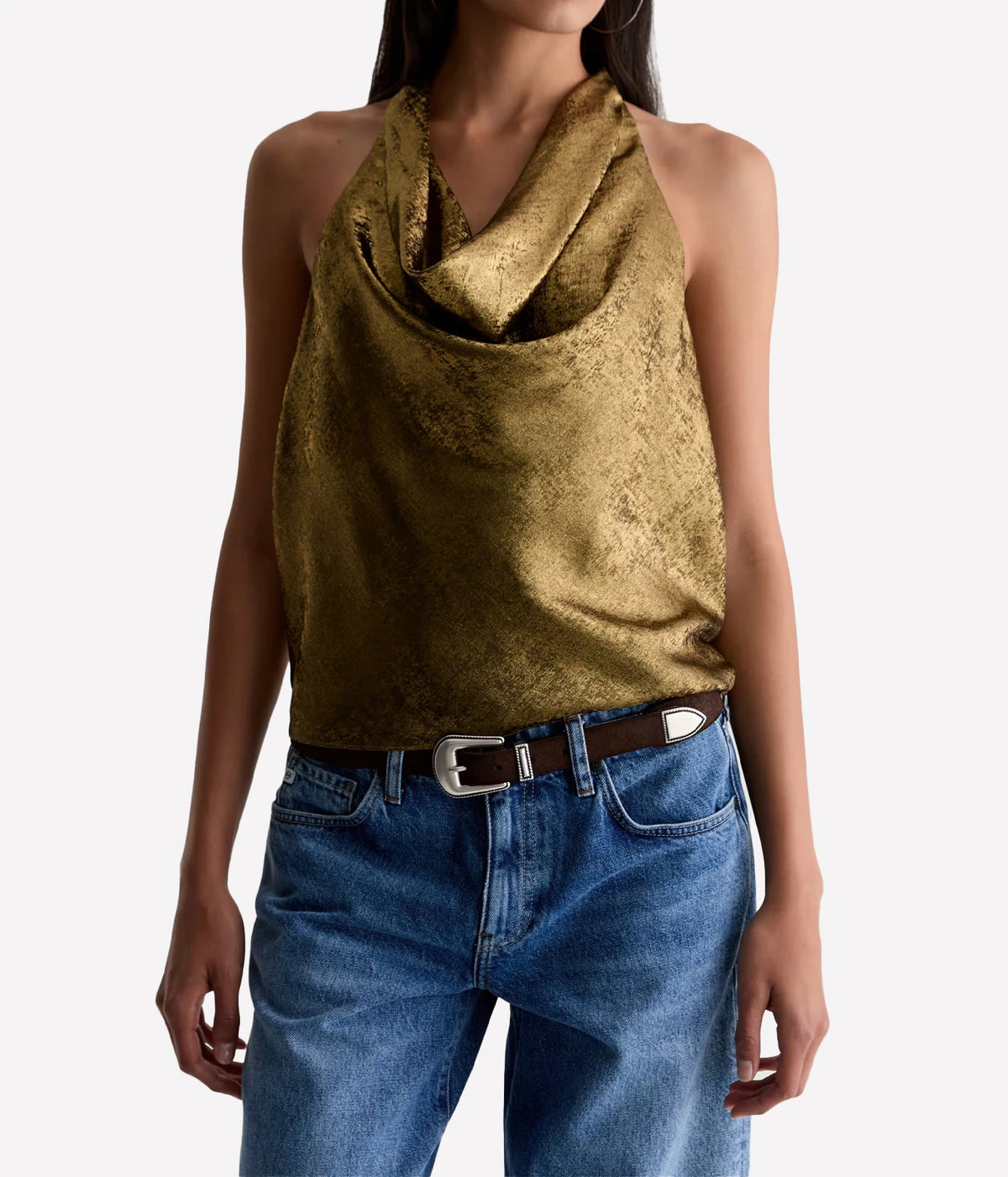 Model wearing the AG Kacey Top in Wild Light with mid-blue jeans and a black leather belt with a silver buckle, showing the draped cowl neckline