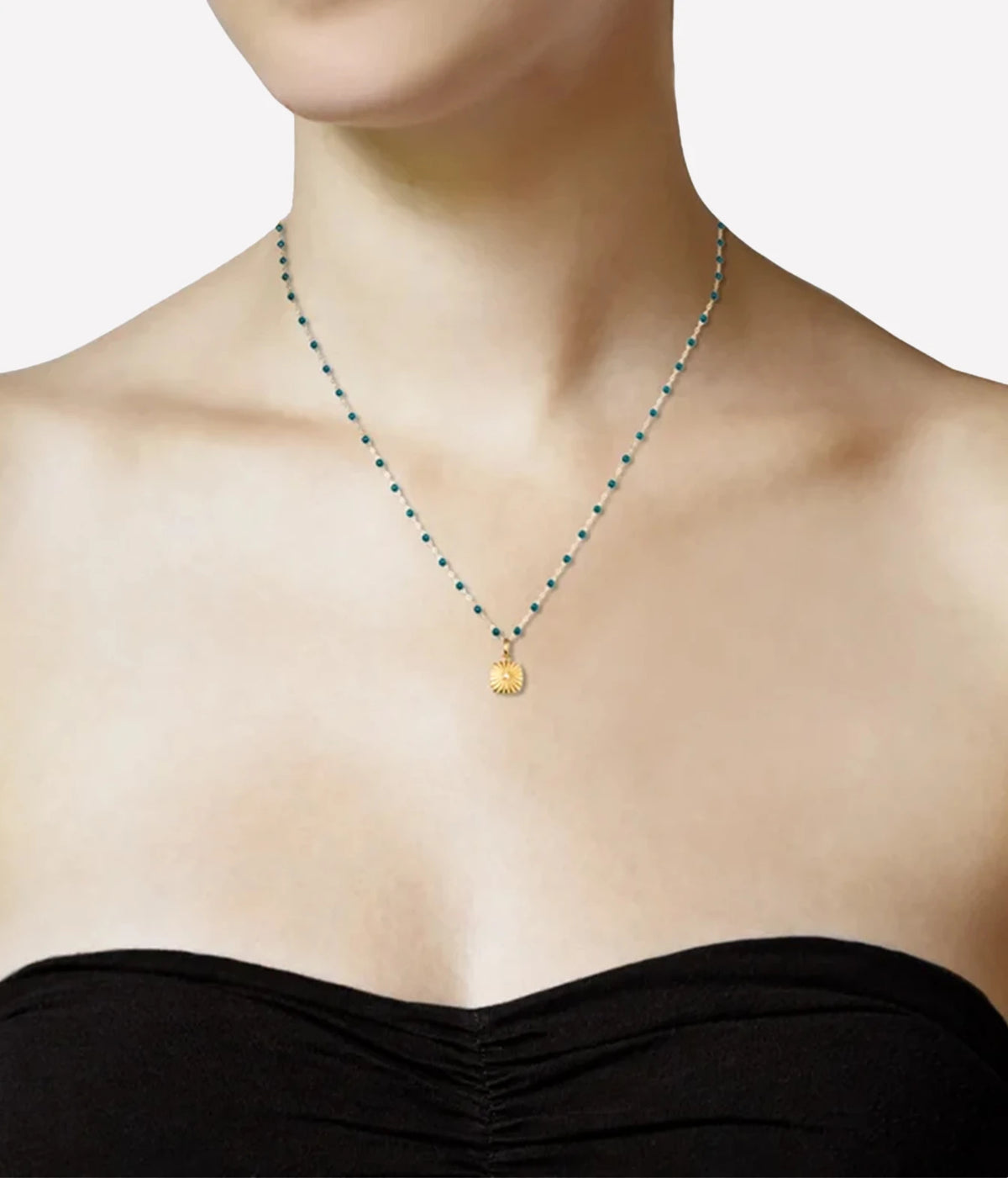 Model wearing the gigiCLOZEAU Miss Lumiere Diamond Pendant on a fine beaded chain with a black strapless top