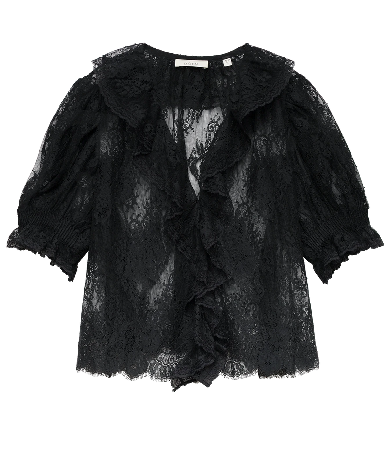 DÔEN Lace Henri Top In Black laid flat, showing the sheer black lace, ruffled V-neck front and gathered puff sleeves