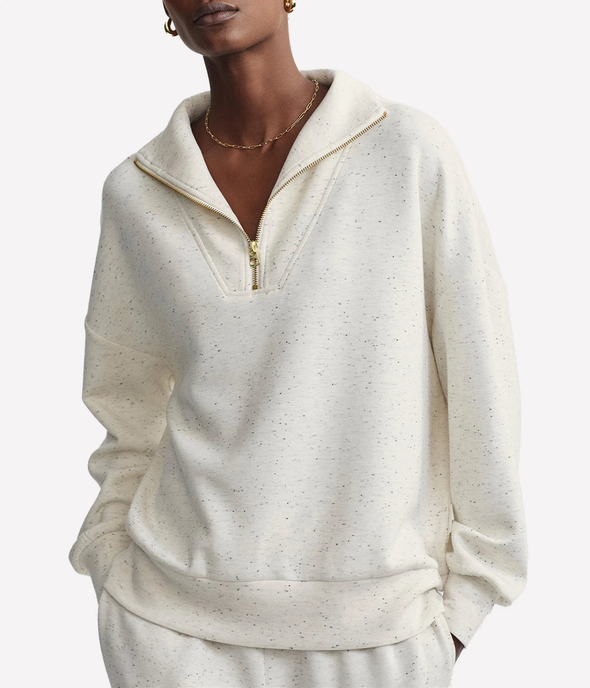  Featuring a panelled half-zip neck for adjustable wear and deep cuffs with a relaxed hem band, it offers a cozy yet stylish silhouette. 