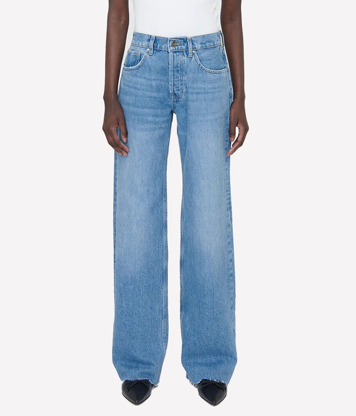 The Hugh Jean is a relaxed, '90s-inspired jean crafted from a midweight, rigid organic-cotton blend. With no stretch, these jeans feature a classic blue wash, enhanced by vintage-inspired grinding, hand sanding, and subtle highs and lows throughout for an authentic, lived-in look. The wide, full-length leg and raw-edge hem add to the timeless appeal, making these jeans a perfect blend of comfort and style. Made in Turkey for premium quality and craftsmanship.