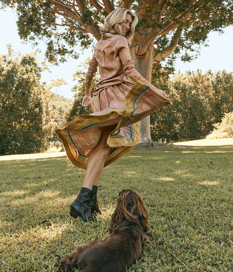 Pierre-Louis Mascia Aloe Silk Skirt in Terracotta Multi, worn on model with the matching Aloe Shirt, showing the full skirt and contrast hem in motion