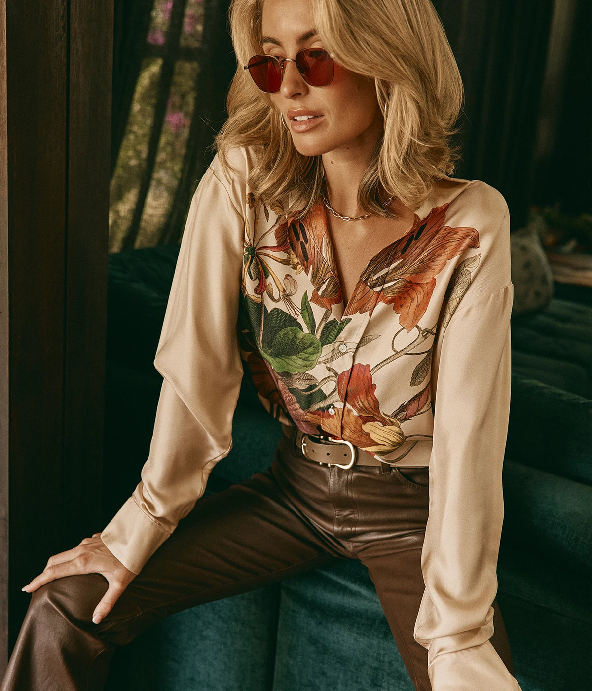 SPRWMN 5 Pkt Ankle Slim Straight Leather Pant In Milk Chocolate, worn on model with a floral print silk shirt, a tan belt and red-tinted sunglasses