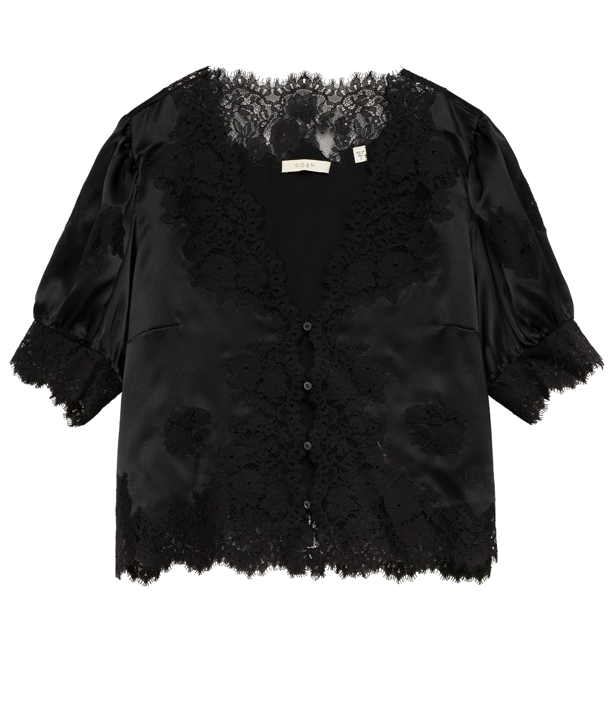 DÔEN Idella Top In Black laid flat, showing the black satin short puff sleeves, scalloped lace trim and button-front placket