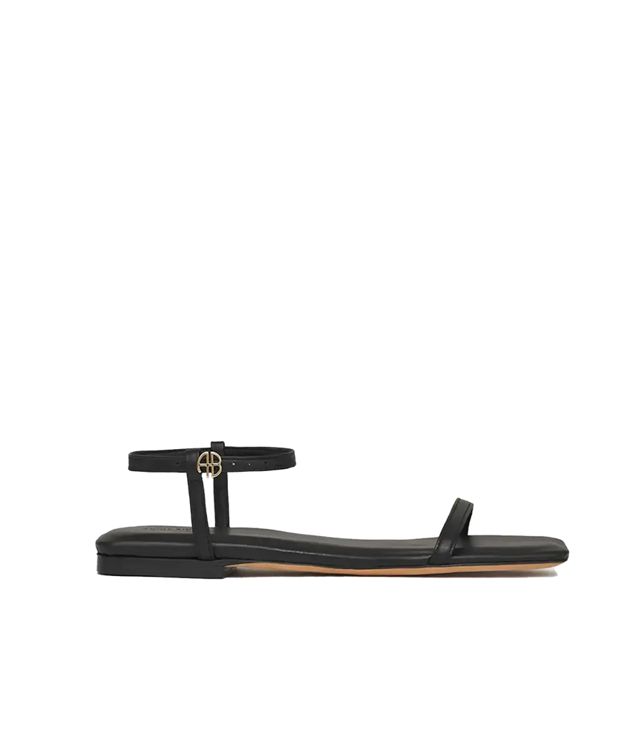 An everyday classic black 100% leather sandals. Featuring a dainty ankle strap and classic Anine Bing Emblim. Throw on and go, summer sandal, comfortable, classic sandal, made internationally.