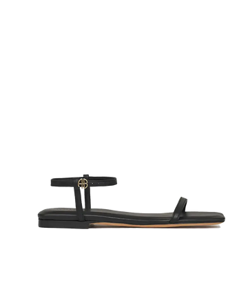 An everyday classic black 100% leather sandals. Featuring a dainty ankle strap and classic Anine Bing Emblim. Throw on and go, summer sandal, comfortable, classic sandal, made internationally.