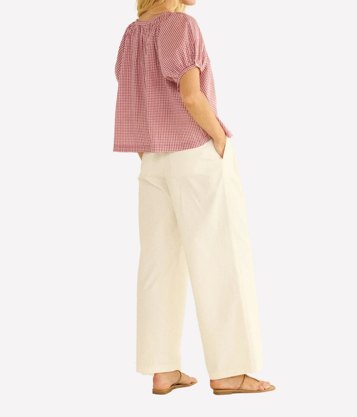 A woman shown from the back wearing  the DÔEN June Top in Mulberry La Maddalena Gingham.