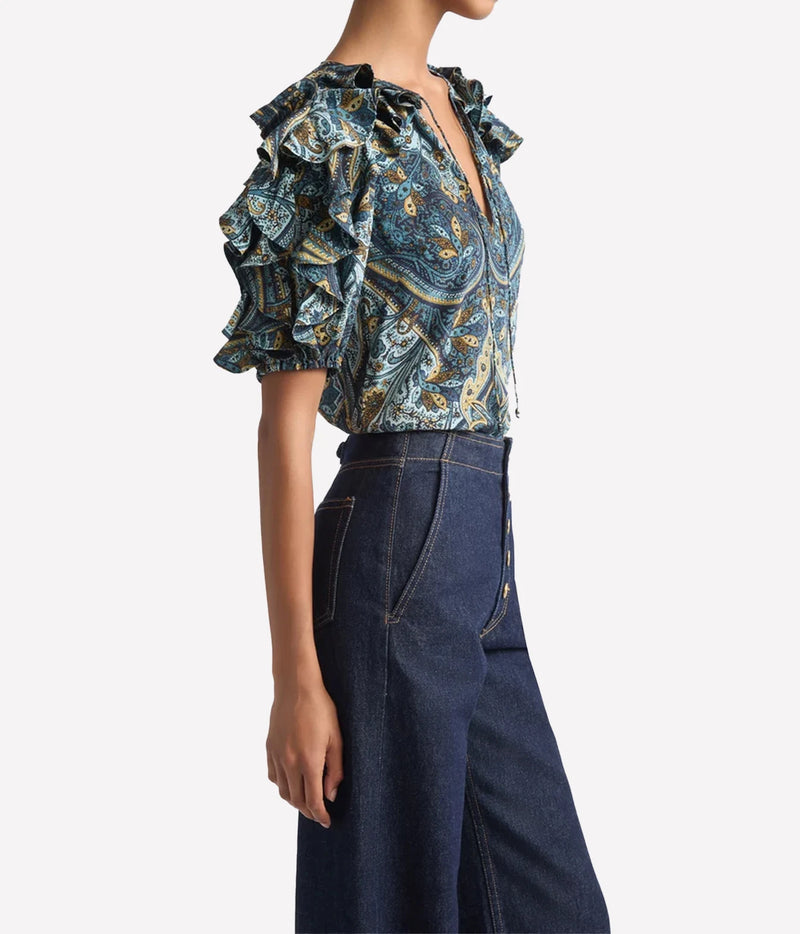 Model wearing Ulla Johnson Josephine Short Sleeve Silk Top in Prussian, side view