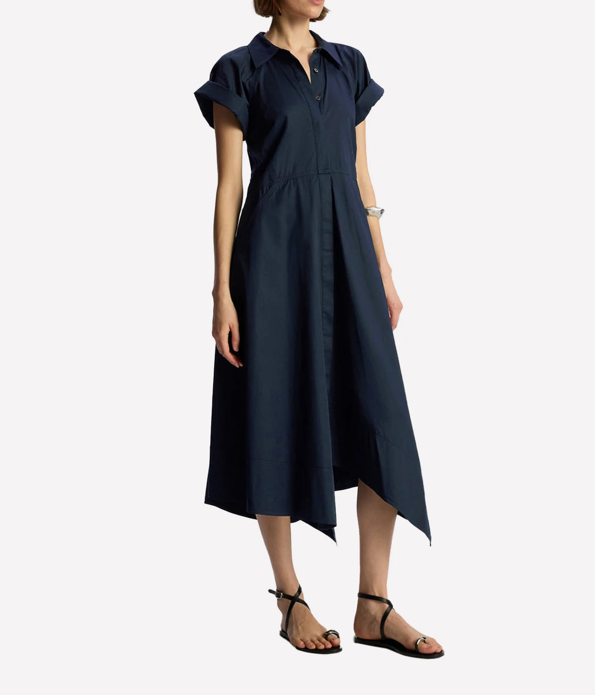 ALT text: Maritime navy cotton midi dress with V-neckline, cap sleeves, fitted bodice, and flared skirt.