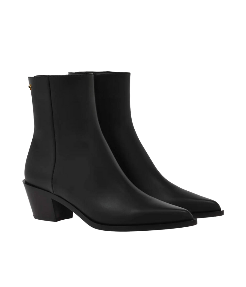 Black leather ankle boots featuring a 45mm block heel and sleek design, styled for versatile day-to-night wear.